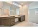 Bright bathroom features double sinks, modern cabinetry, and ample counter space at 25188 N 174Th Ave, Surprise, AZ 85387
