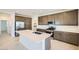 Contemporary kitchen boasts a large center island, stainless steel appliances, abundant cabinet space, and recessed lighting at 25188 N 174Th Ave, Surprise, AZ 85387
