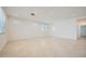 Open-concept living room featuring neutral walls, tile flooring, recessed lighting, and abundant natural light at 25188 N 174Th Ave, Surprise, AZ 85387