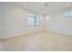 Bright living room with neutral walls, tile flooring, recessed lighting, and ample natural light from multiple windows at 25188 N 174Th Ave, Surprise, AZ 85387