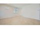 Spacious living room with tile flooring, recessed lights, and plenty of natural light creating a bright, airy space at 25188 N 174Th Ave, Surprise, AZ 85387