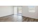 Bright bedroom with sliding glass doors and view of exterior landscape at 25251 N 183Rd Dr, Wittmann, AZ 85361