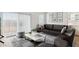 Stylish living room with a comfortable sofa, modern decor, and plenty of natural light at 25251 N 183Rd Dr, Wittmann, AZ 85361