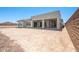 The home's backyard features a covered patio and desert landscaping at 27046 W Rockwood Dr, Buckeye, AZ 85396