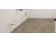 A spacious unfinished basement with tile flooring and exposed utilities at 27046 W Rockwood Dr, Buckeye, AZ 85396