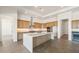 Spacious kitchen with a center island, stainless steel appliances, light wood cabinetry, and recessed lighting at 27046 W Rockwood Dr, Buckeye, AZ 85396
