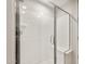 Modern bathroom featuring a glass-enclosed shower with built-in seat at 27110 W Adam Ave, Buckeye, AZ 85396