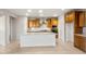 Bright kitchen with a large center island, stainless steel appliances, and lots of cabinets at 27110 W Adam Ave, Buckeye, AZ 85396