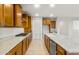 Spacious kitchen featuring wood cabinetry, a large island, and granite countertops at 27110 W Adam Ave, Buckeye, AZ 85396