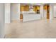 Bright kitchen featuring a center island with light countertops and abundant natural light at 27110 W Adam Ave, Buckeye, AZ 85396