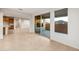Bright living area features neutral tile floors and access to outdoor space at 27110 W Adam Ave, Buckeye, AZ 85396