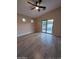 Bedroom boasts sliding glass doors to the backyard and features wood-look flooring at 2729 E Carol Ave, Mesa, AZ 85204