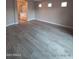 Bright bedroom with wood floors and en suite bathroom at 2729 E Carol Ave, Mesa, AZ 85204