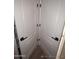 A white linen closet with black hardware showcases ample storage at 2729 E Carol Ave, Mesa, AZ 85204