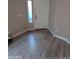 Bright entryway features a white door, a slim window, and light-colored wood-look flooring at 2729 E Carol Ave, Mesa, AZ 85204