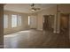 Bright open-plan living room with tile floors, recessed lighting and lots of natural light at 2729 E Carol Ave, Mesa, AZ 85204