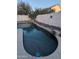 Lush backyard with a sparkling pool and stone accents at 2729 E Carol Ave, Mesa, AZ 85204