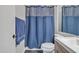 Cozy bathroom featuring a vanity, mirror, toilet, modern shower curtain, and contrasting dark tile floors at 2834 S Extension Rd # 1079, Mesa, AZ 85210