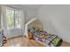 bedroom with hardwood floors and a cute bed with toy accents near the window at 2834 S Extension Rd # 1079, Mesa, AZ 85210