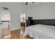 Bright bedroom with connected bathroom, hardwood floors, and comfortable bedroom set at 2834 S Extension Rd # 1079, Mesa, AZ 85210