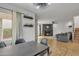 Bright dining area with modern lighting, adjacent to the living room and with a view to the exterior at 2834 S Extension Rd # 1079, Mesa, AZ 85210