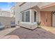 Inviting front entrance with a small private patio area, featuring updated desert-style landscaping at 2834 S Extension Rd # 1079, Mesa, AZ 85210