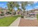 Beautifully landscaped community with mature trees, green grass, and cozy gathering spots at 2834 S Extension Rd # 1079, Mesa, AZ 85210