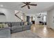 Comfortable open-concept living area with fireplace, ceiling fan, and view into the kitchen and dining area at 2834 S Extension Rd # 1079, Mesa, AZ 85210