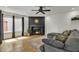 Cozy living room featuring a modern fireplace and comfortable sectional seating on a neutral rug at 2834 S Extension Rd # 1079, Mesa, AZ 85210