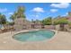 Community pool and spa surrounded by lounge chairs and well-maintained grounds for resident enjoyment at 2834 S Extension Rd # 1079, Mesa, AZ 85210