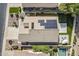 Aerial view of the property featuring solar panels, a putting green, swimming pool, and outdoor seating at 3662 E Megan St, Gilbert, AZ 85295