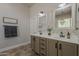 Well-lit bathroom featuring dual sinks, framed mirrors, and white subway tile accents at 3662 E Megan St, Gilbert, AZ 85295