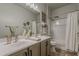 Updated bathroom with double vanity, mirrors, and shower-tub combination at 3662 E Megan St, Gilbert, AZ 85295