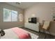 Cozy bedroom features a large window, modern furniture, and stylish decor, creating a relaxing retreat at 3662 E Megan St, Gilbert, AZ 85295