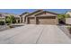 Expansive driveway and charming exterior, creating an inviting and well-maintained entrance to the home at 3662 E Megan St, Gilbert, AZ 85295