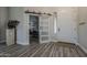 Bright foyer features wood-look floors, modern sliding barn door, and stylish decor, creating an inviting entrance at 3662 E Megan St, Gilbert, AZ 85295