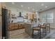 Modern kitchen with stainless steel appliances, custom cabinets, and a central island with seating at 3662 E Megan St, Gilbert, AZ 85295