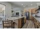 Open kitchen floor plan with an island, stainless appliances, and light wood cabinets at 3662 E Megan St, Gilbert, AZ 85295