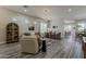 Open-concept living and dining area offers a seamless flow for entertaining, highlighted by stylish furnishings at 3662 E Megan St, Gilbert, AZ 85295