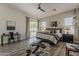 Inviting main bedroom with a ceiling fan, sliding glass doors, and a decorative area rug at 3662 E Megan St, Gilbert, AZ 85295