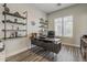 Functional office with stylish shelving and a large window for natural light, ideal for productivity at 3662 E Megan St, Gilbert, AZ 85295