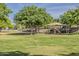 Spacious green community park with playground area featuring play structure and shady trees at 3662 E Megan St, Gilbert, AZ 85295