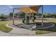 Well-maintained playground featuring a covered climbing structure and slides in a sandy area at 3662 E Megan St, Gilbert, AZ 85295