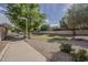 Neighborhood sidewalk lined with lush green trees and well-maintained landscaping at 3662 E Megan St, Gilbert, AZ 85295