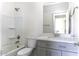 Well-lit bathroom features a shower-tub combination and a modern gray vanity with a white countertop at 3725 N Bandelier Dr, Eloy, AZ 85131