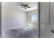 This bedroom boasts a ceiling fan, neutral walls, and a window providing ample natural light at 3725 N Bandelier Dr, Eloy, AZ 85131
