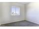 A bedroom is well lit with carpet flooring and has a window that provides natural light at 3725 N Bandelier Dr, Eloy, AZ 85131
