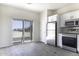 Well-lit kitchen featuring white cabinetry, stainless steel appliances, and sliding glass doors at 3725 N Bandelier Dr, Eloy, AZ 85131