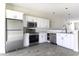 Kitchen featuring white cabinetry and stainless steel appliances at 3725 N Bandelier Dr, Eloy, AZ 85131