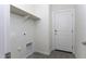 Laundry room features a shelf, washer hookups, and a door to the exterior of the home at 3725 N Bandelier Dr, Eloy, AZ 85131